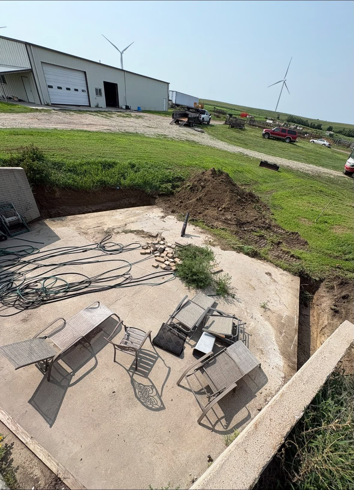 Excavated residential patio area prepared for a concrete expansion
